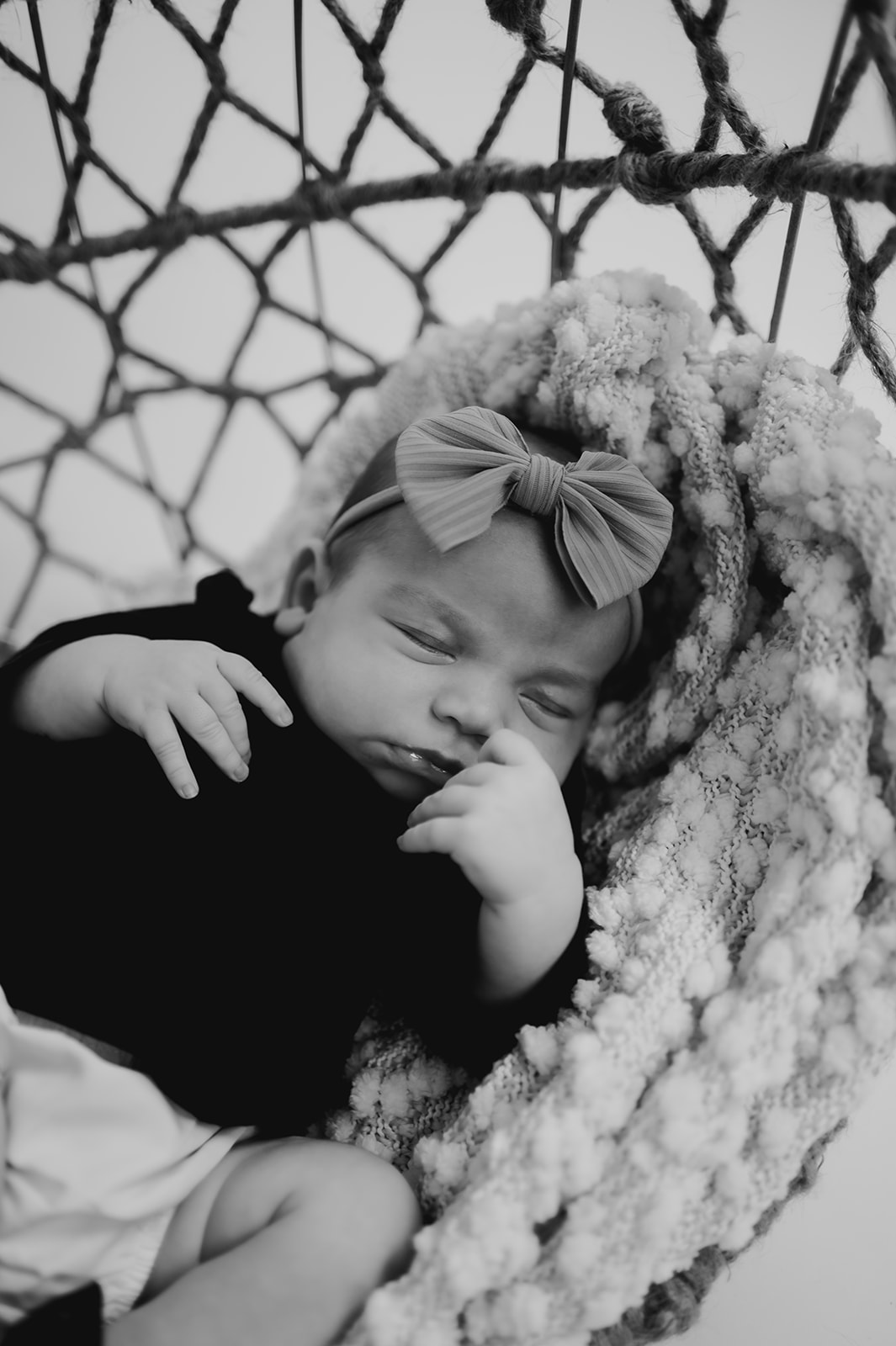 Black and white baby photo with bow in Queensbury NY